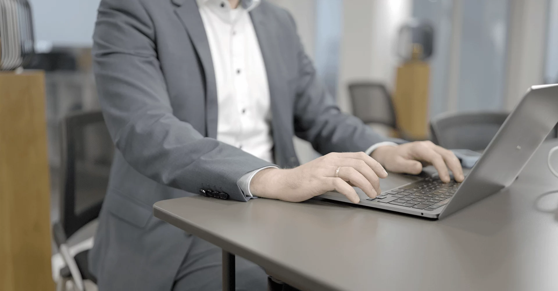 Consultant working on a laptop.